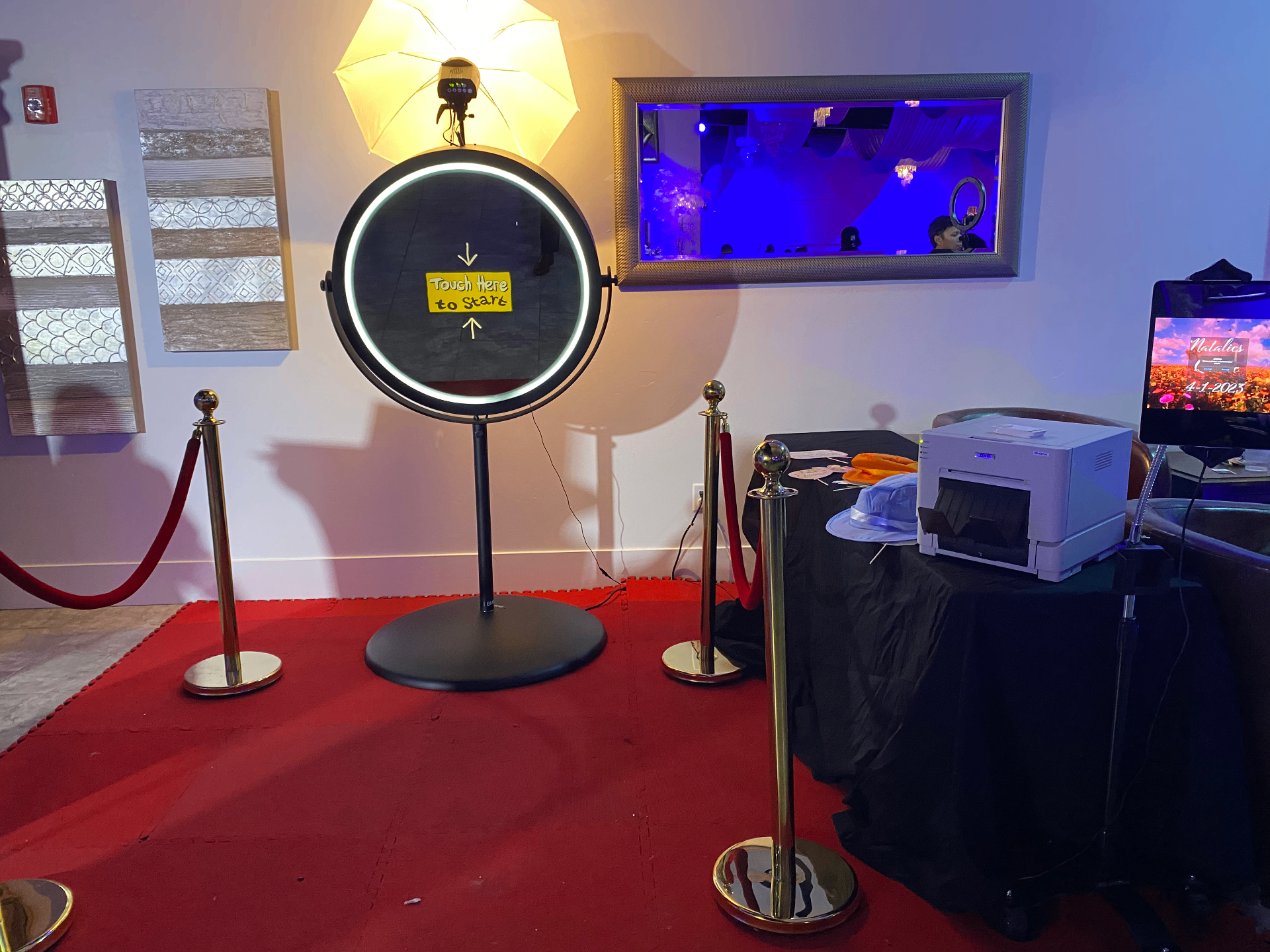 Beauty Mirror Booth setup with red carpet and stanchions at a Utah event