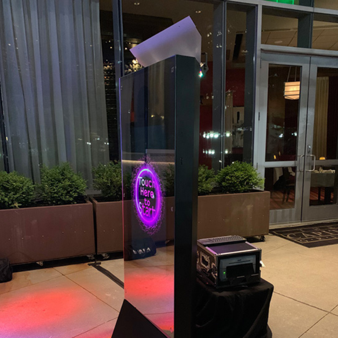 Mirror Air Booth set up on a patio with instant printer