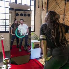 Couple using the mirror photo booth on the red carpet